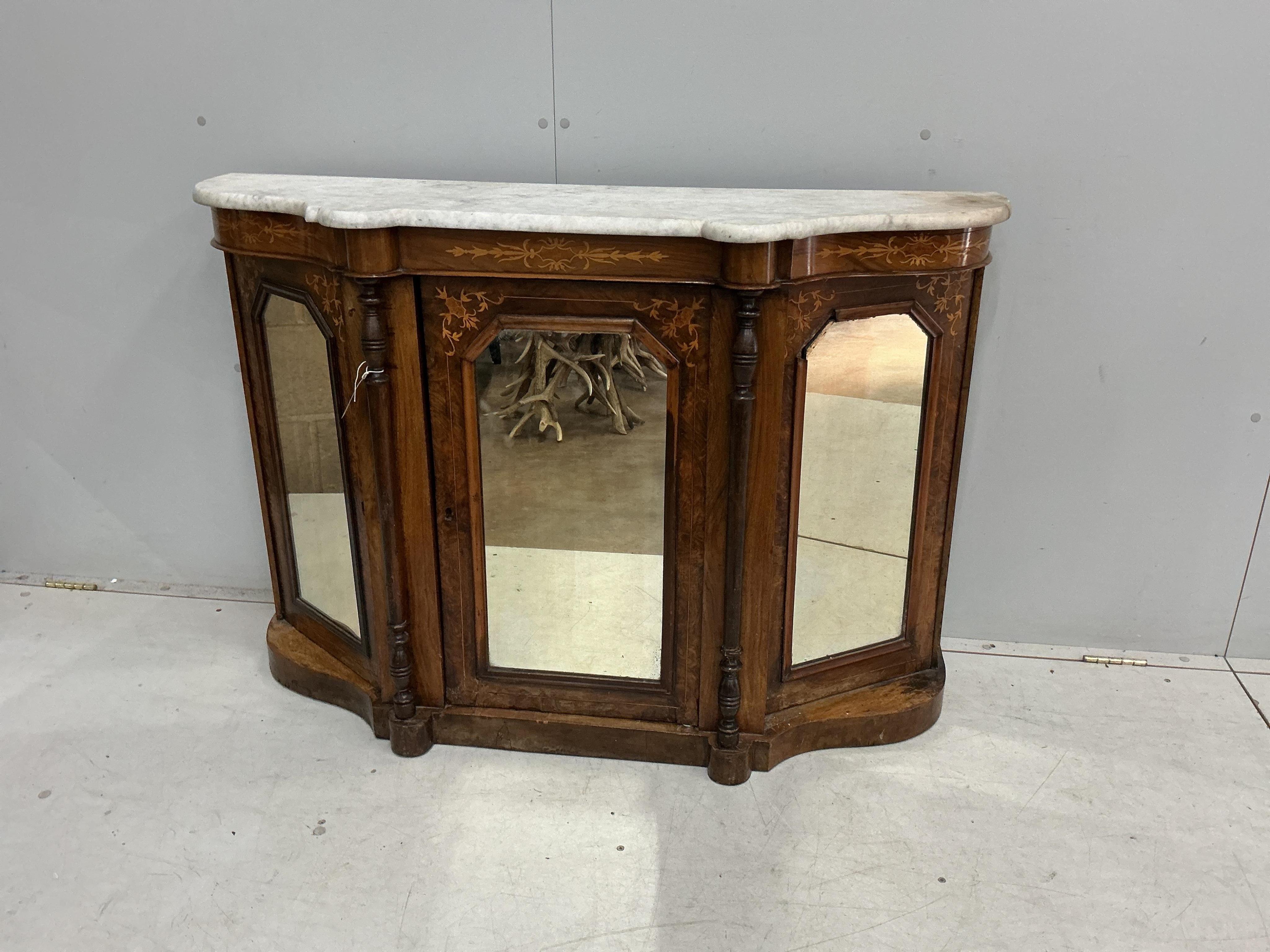 A late Victorian marquetry inlaid marble topped mirrored walnut side cabinet, width 122cm, depth 39cm, height 84cm